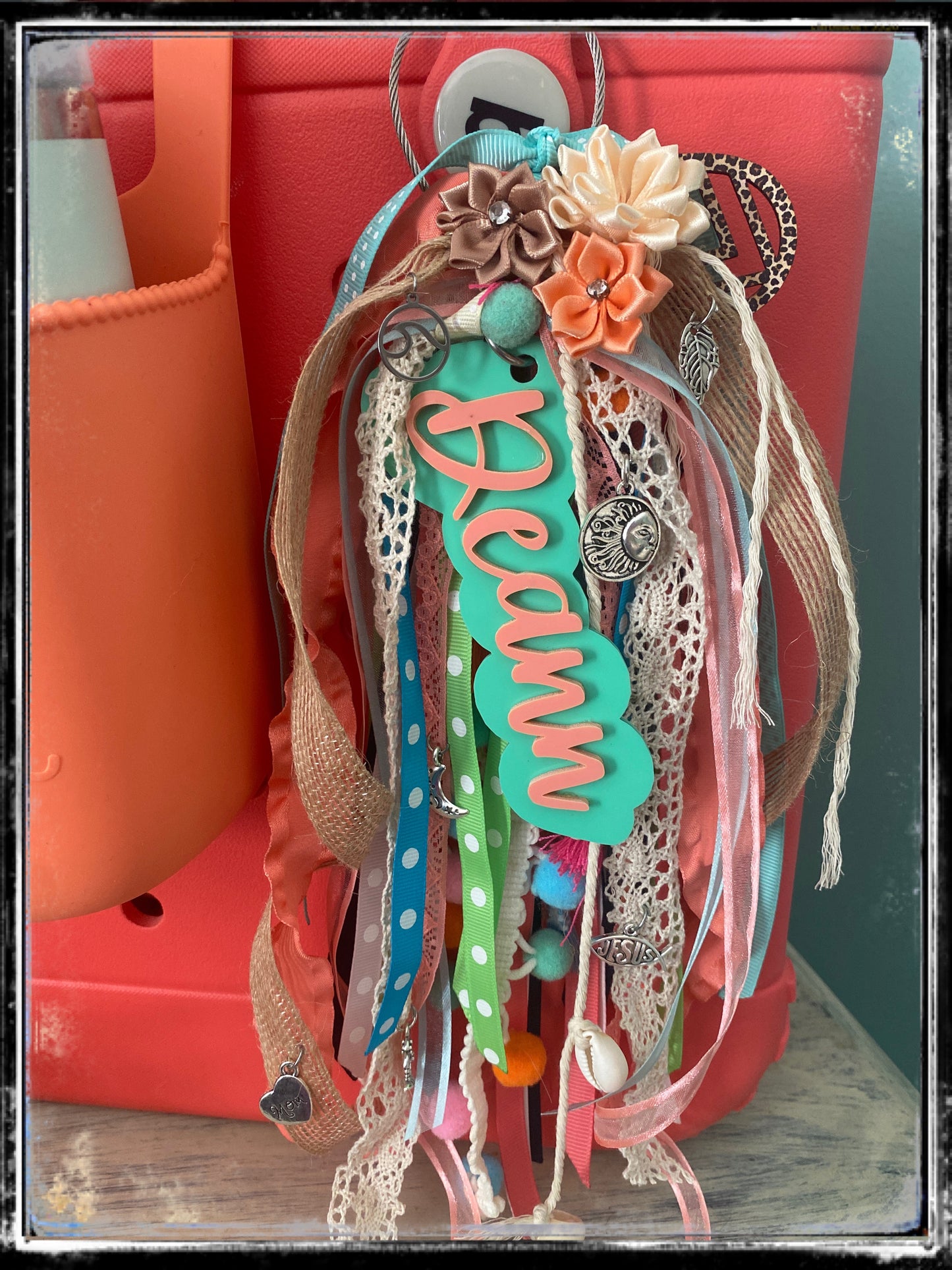 Over the top customer charm tassel