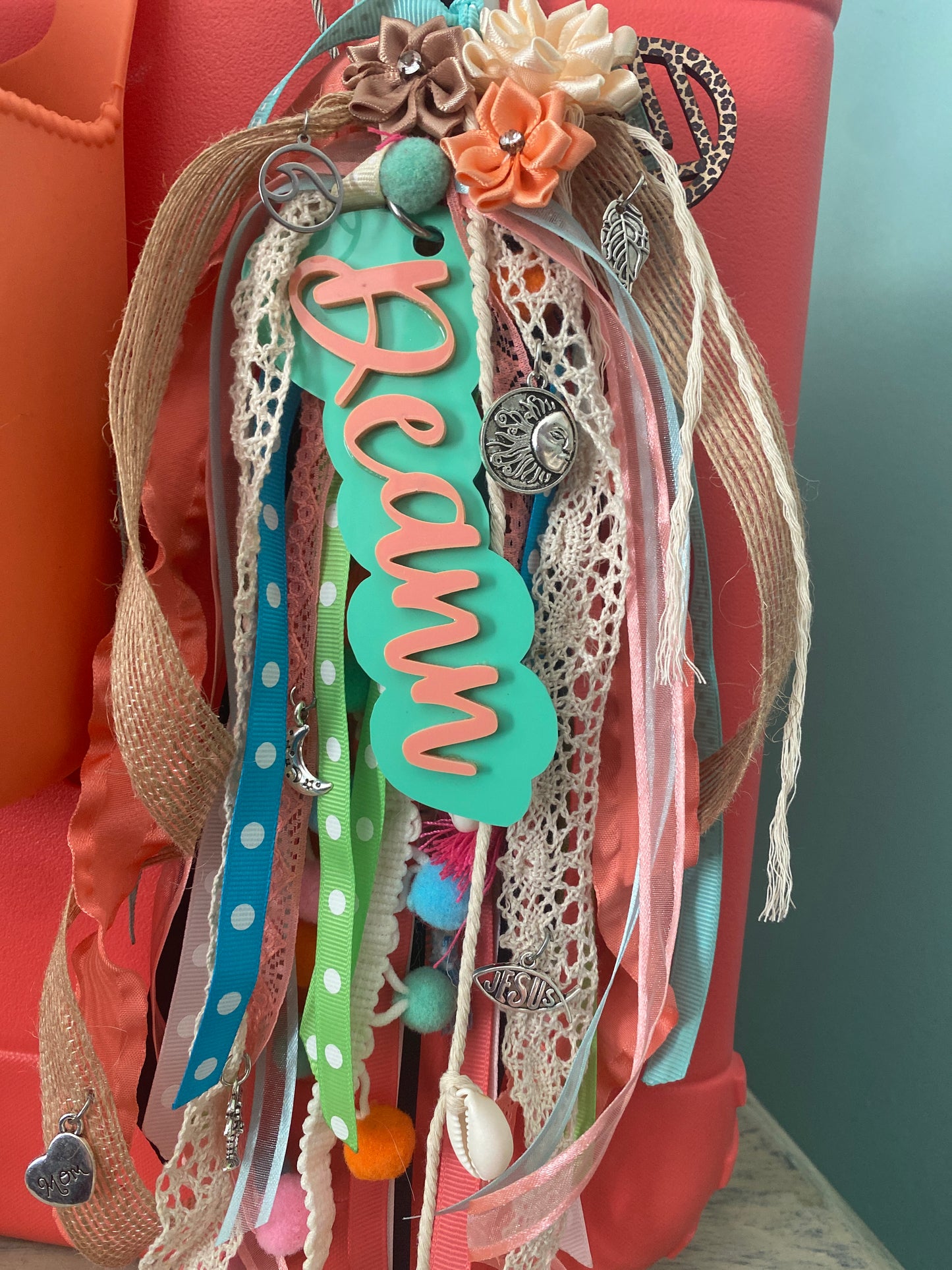 Over the top customer charm tassel