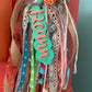 Over the top customer charm tassel